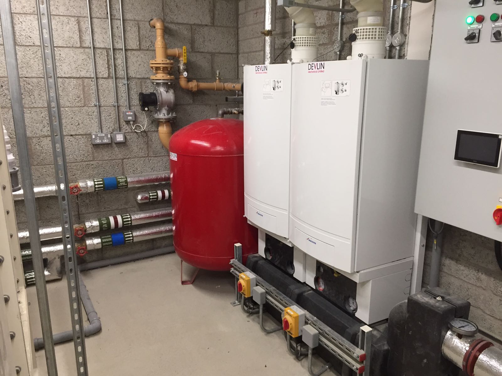 Boilers and pipework in the new plant room at St Columb's College, Derry